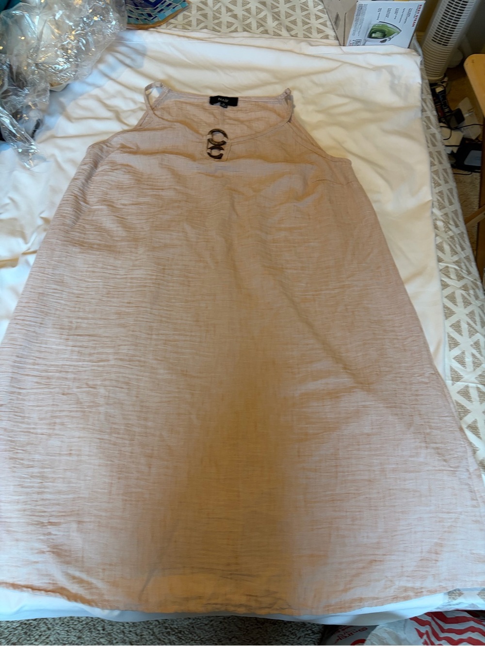 NAIF cream midi dress with gold buckle design and adjustable strap.